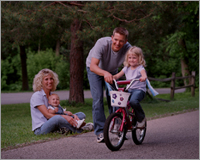 Family Portrait capturing daughter's first bike ride