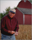 Individual Portrait of soybean farmer in field